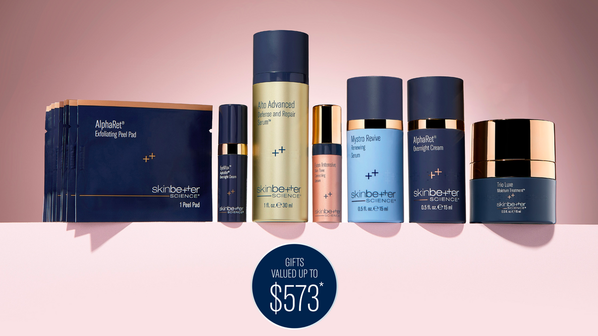 Collection of skincare products with a pink background