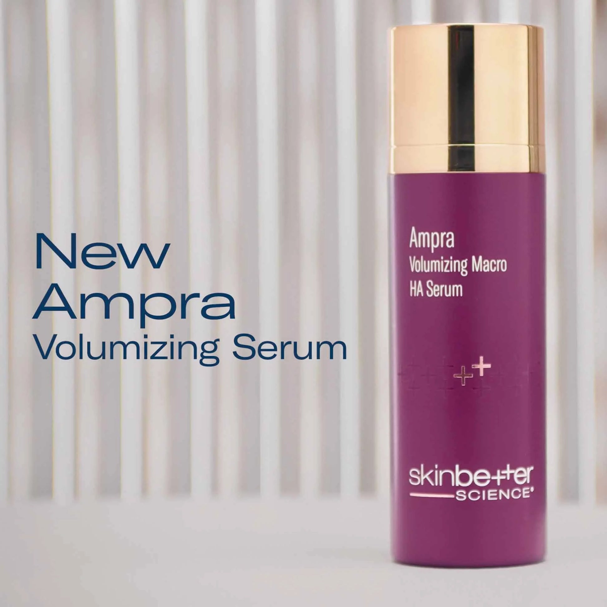 Purple skincare serum bottle with gold cap on a light background, featuring 'New Ampra Volumizing Serum' text.
