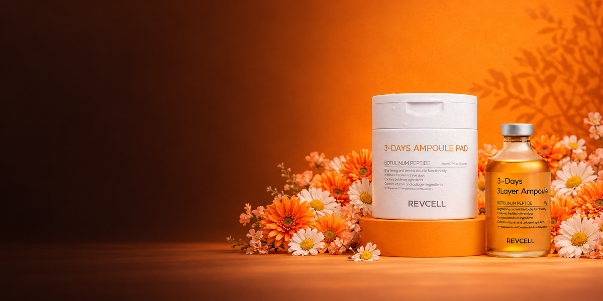 REVCELL ampoule pads and serum displayed with orange and white flowers